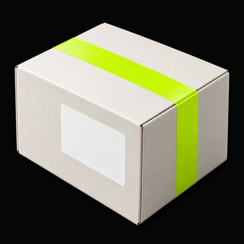 A white cardboard parcel sealed with lime tape and a blank label
