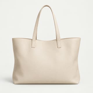 A cream leather tote bag with two handles
