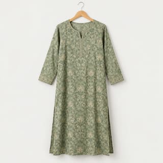 A sage green printed kurta on a hanger
